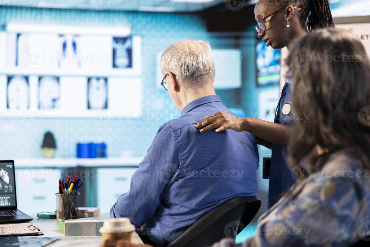 Healthcare expert conducts a physical routine checkup on senior patient, addressing spinal issues and providing solutions for pain management and improved mobility in a medical clinic. photo