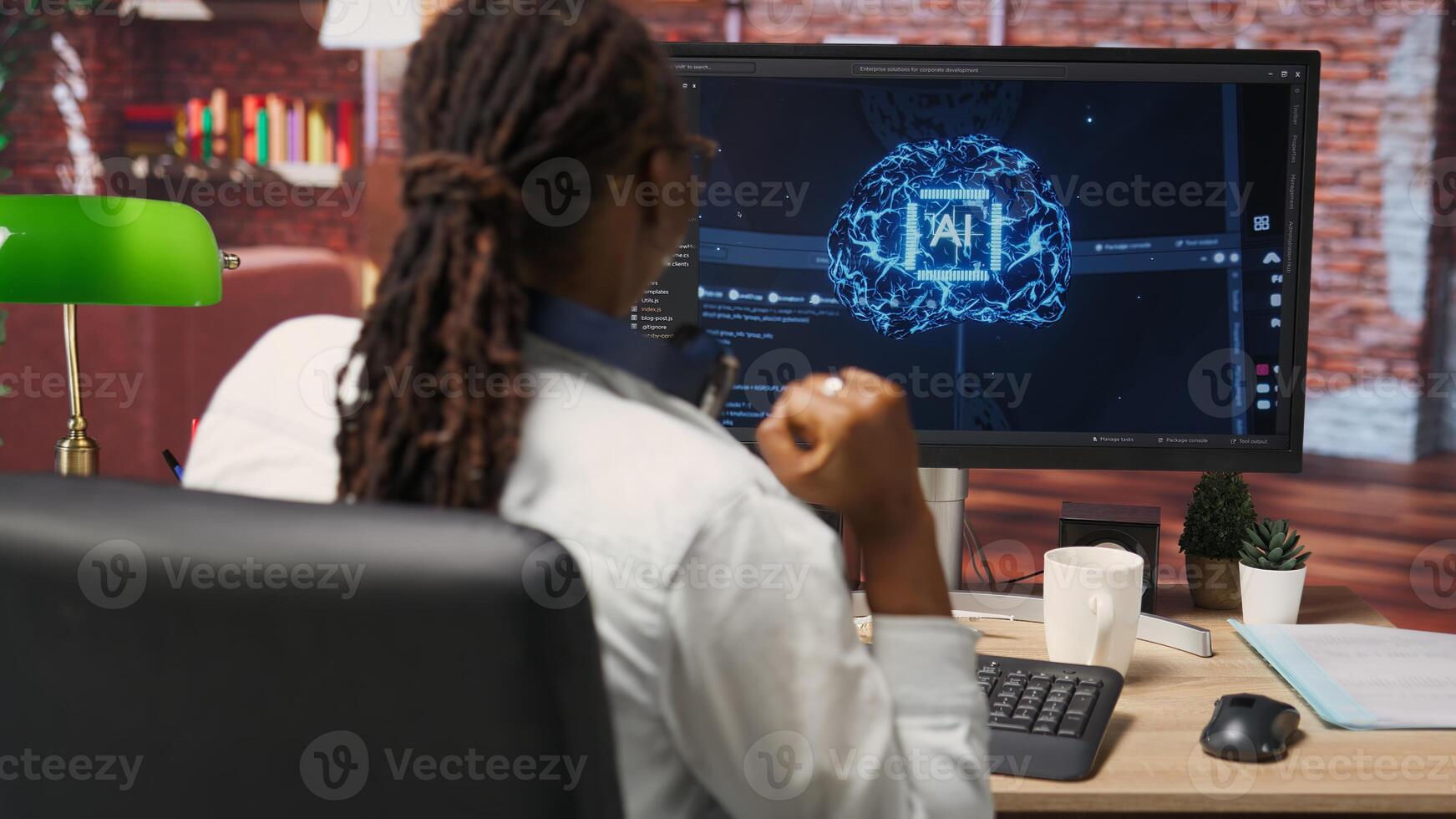 Happy programmer celebrating after successfully implementing code using artificial intelligence computing. Cheerful employee excited after finishing work on AI deep neural networks on PC, camera B photo