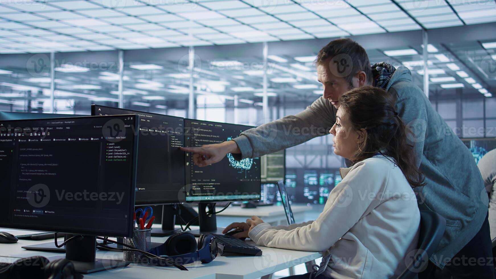IT technicians in server farm brainstorming ways to repair equipment storing datasets. Colleagues at work in data center discussing how to mend rigs doing computational operations, camera B photo