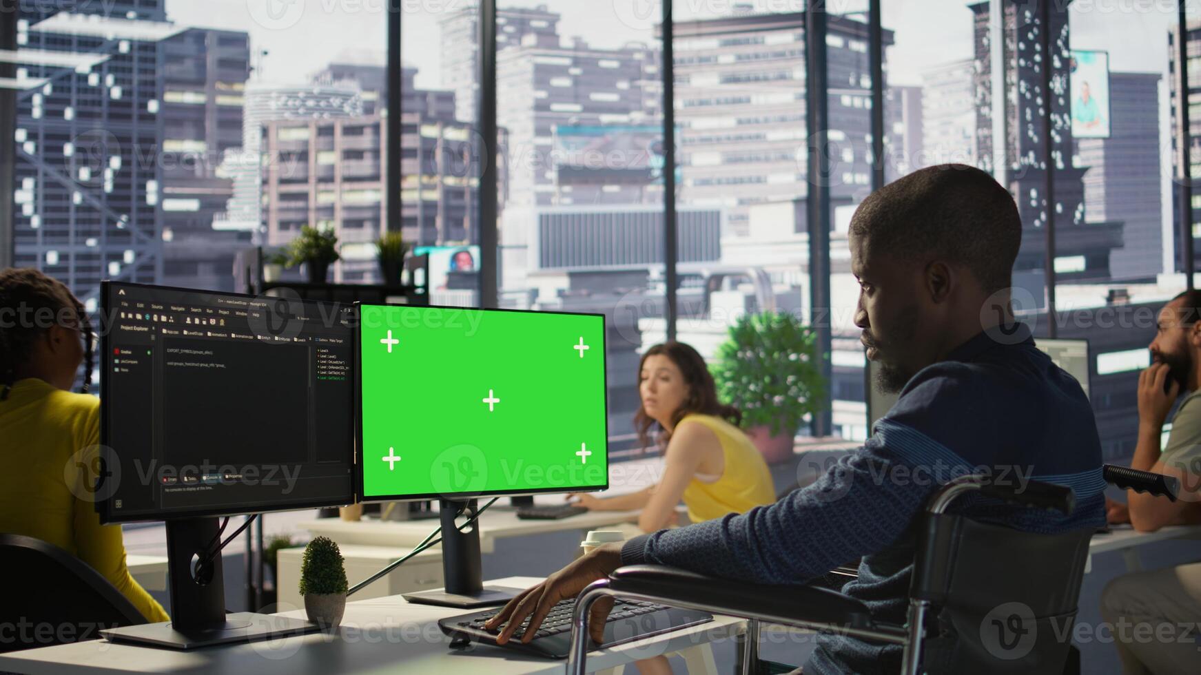 Person with disability testing and deploying programs and systems on green screen PC. Software technician in wheelchair checking code on mockup PC, sitting at desk in office, camera B photo