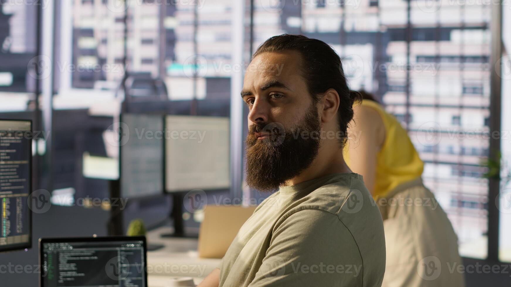 Portrait of smiling machine learning infrastructure engineer developing algorithms to learn from data. Cheerful man in office training and deploying large scale deep learning models, camera A photo