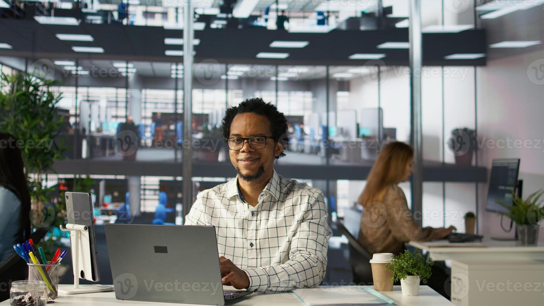 Professional employee at his office desk working on report writing, working on project management and deadline. General manager looking to expand the organization globally, multitasking. Camera B. photo