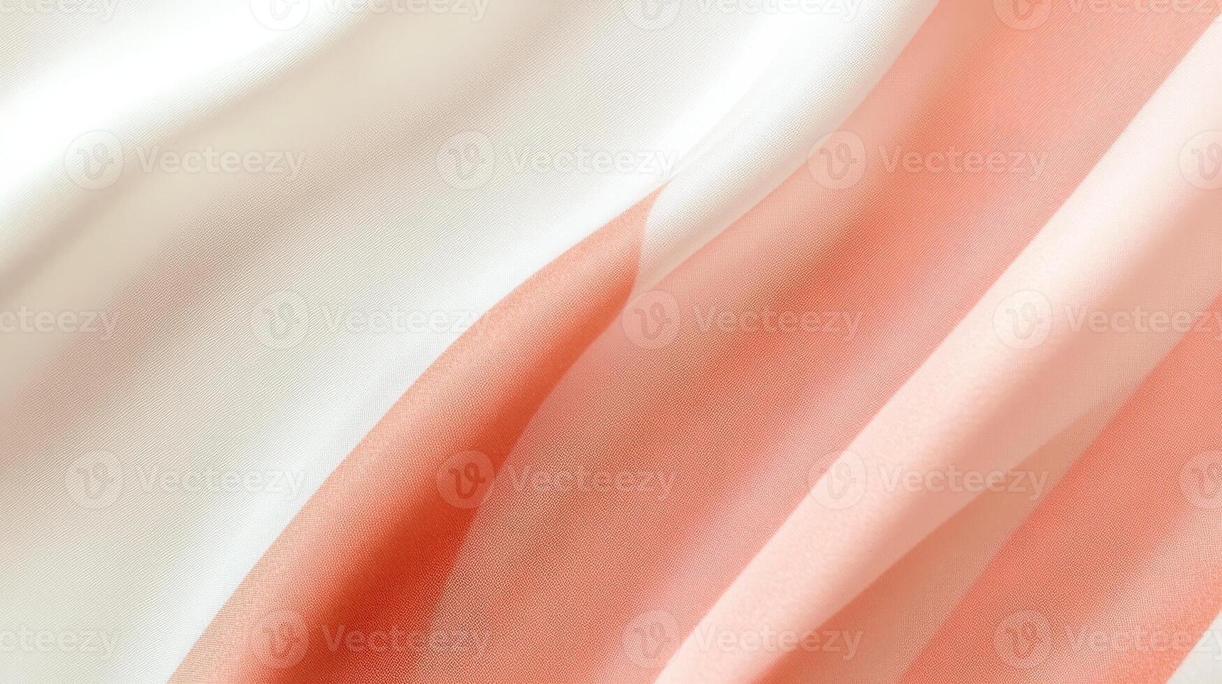 Soft flowing pink and white fabric with elegant wavy patterns highlighting texture photo