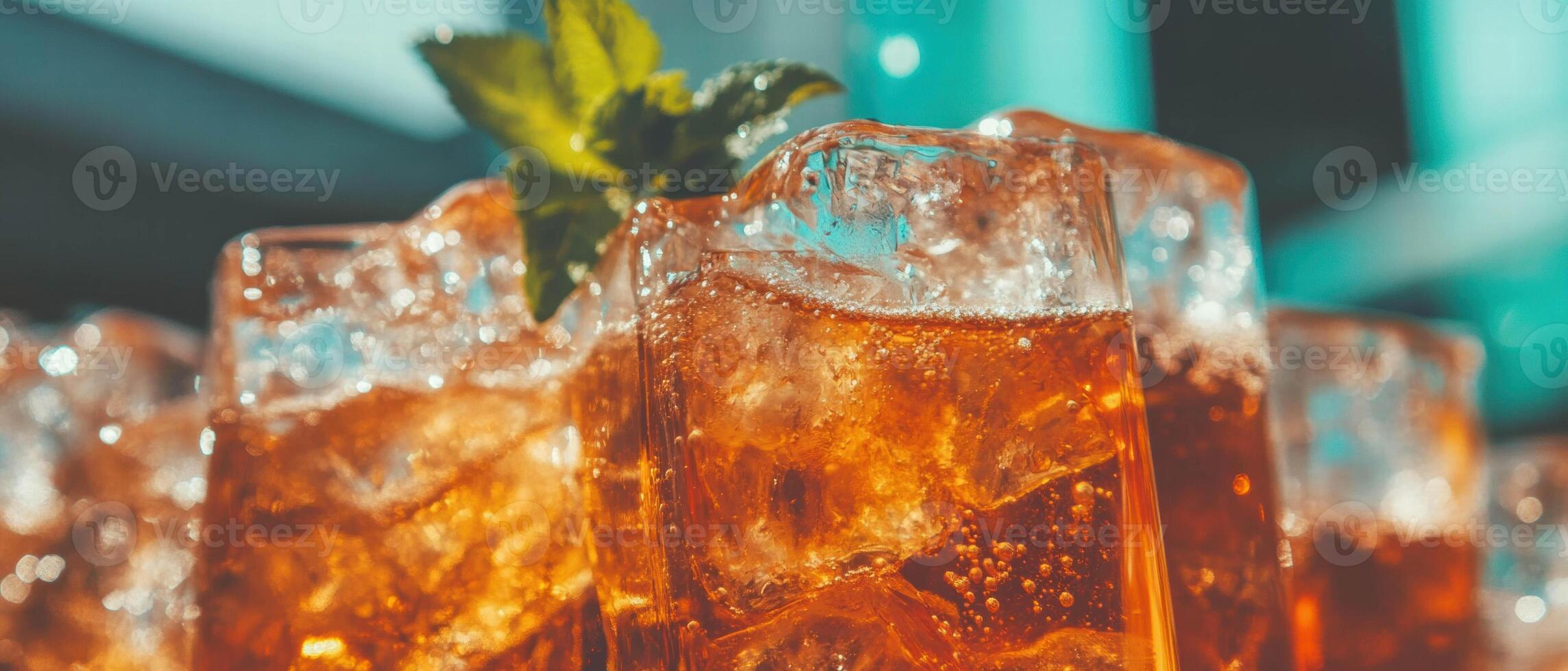 Refreshing iced tea in clear glasses with ice and mint garnish for a delightful summer drink photo
