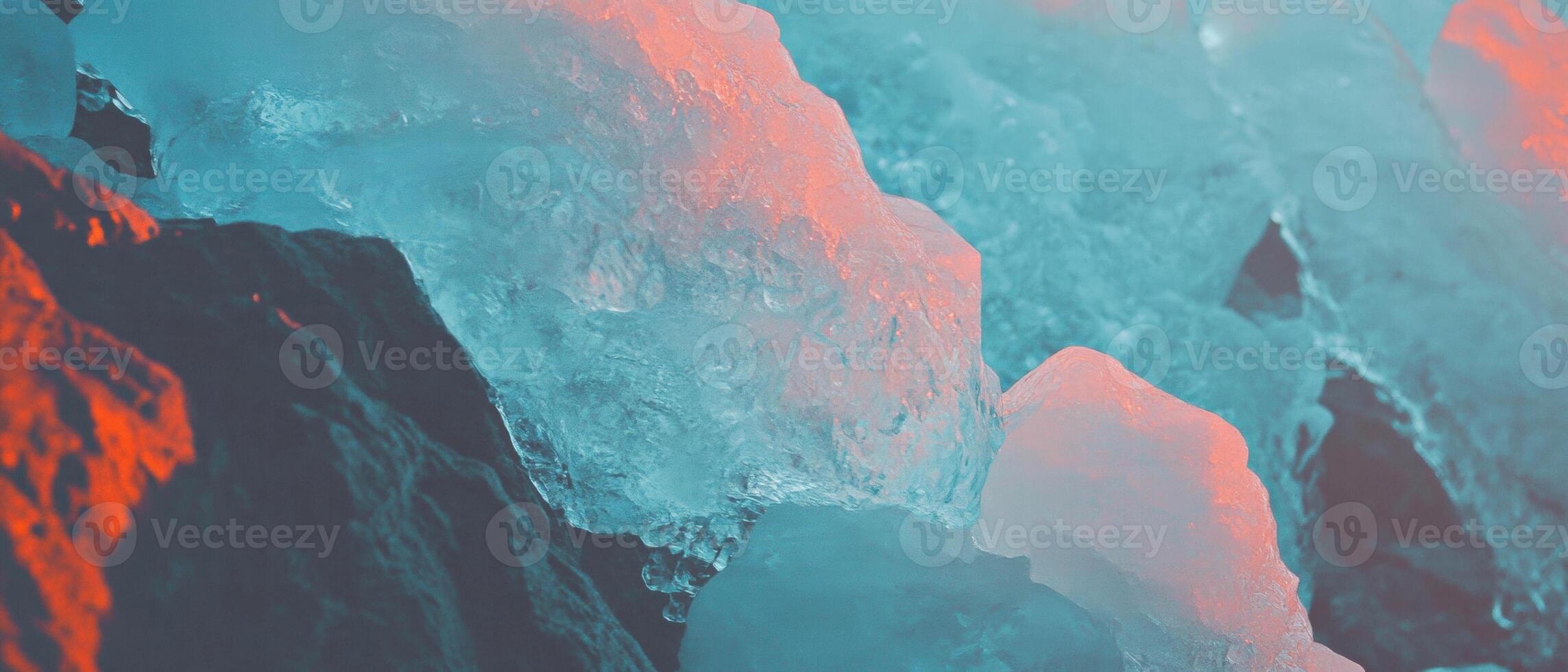 Frozen landscape showcasing ice on rocks illuminated by winter light photo