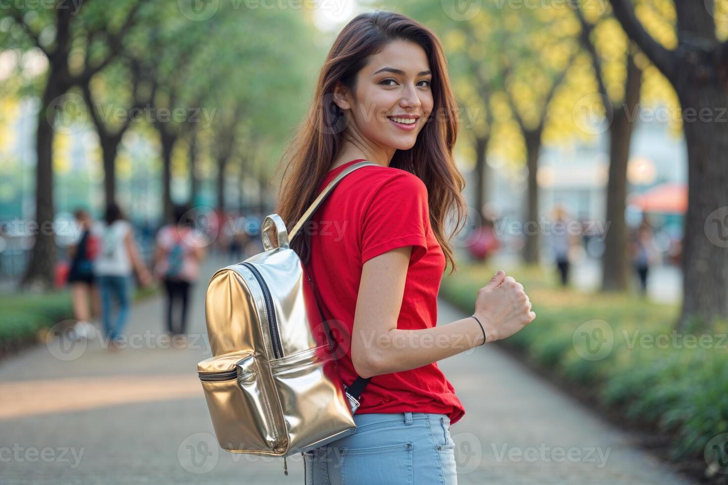 Young Woman with Silver Backpack on Tree-Lined Path photo