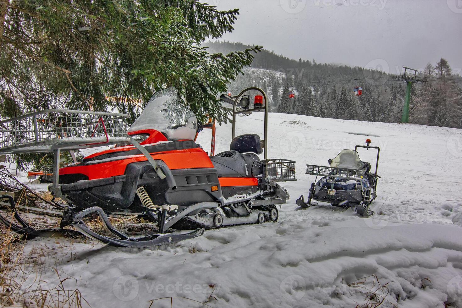 Snowmobile Parked in Winter ski resort photo