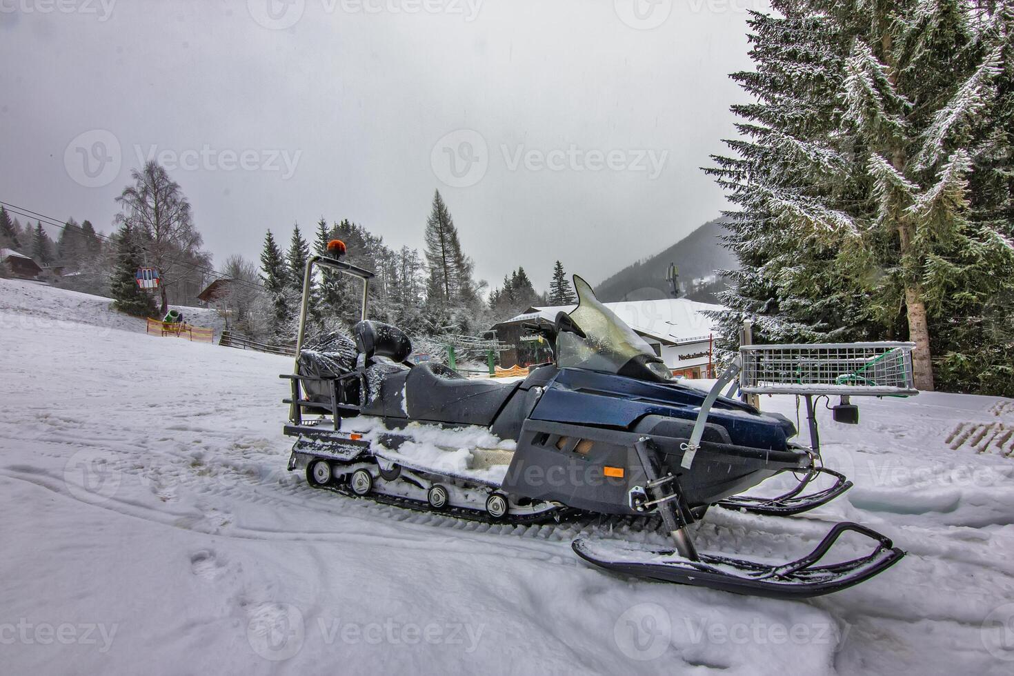 Snowmobile Parked in Winter the Wonderland photo