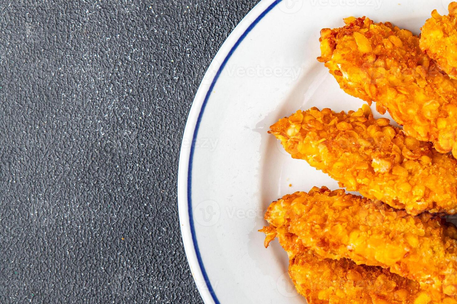 Chicken nuggets in breaded deep fried fresh tasty food dish delicious gourmet food background on the table rustic food top view copy photo