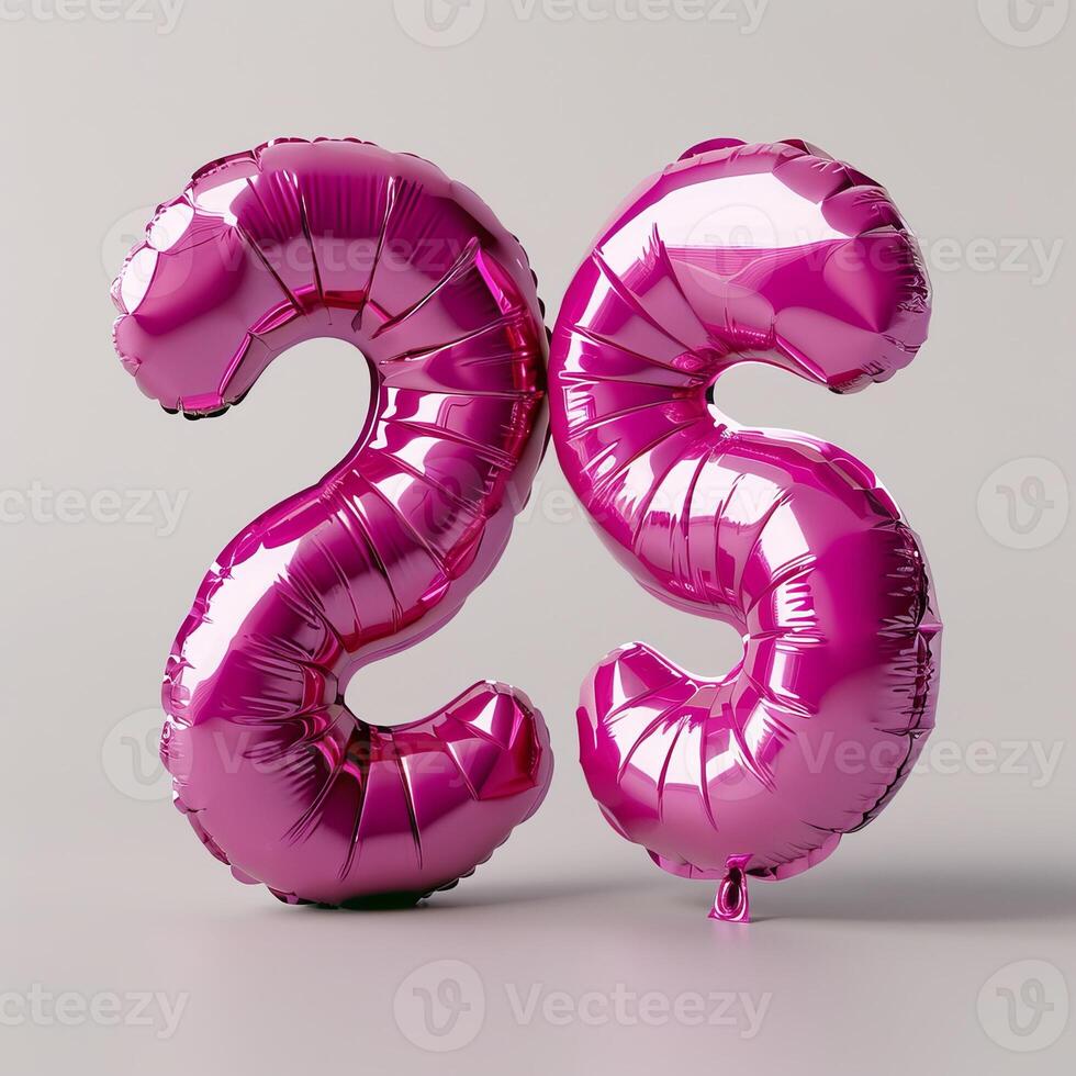 A shiny, metallic pink number 25 balloon stands out against isolated white background photo