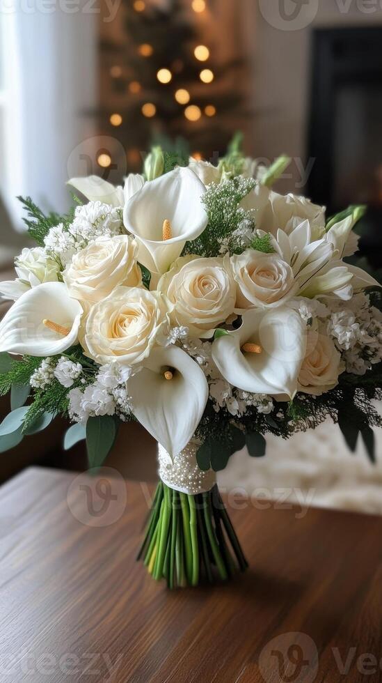 Elegant bridal bouquet with white calla lilies and roses in front of christmas tree photo