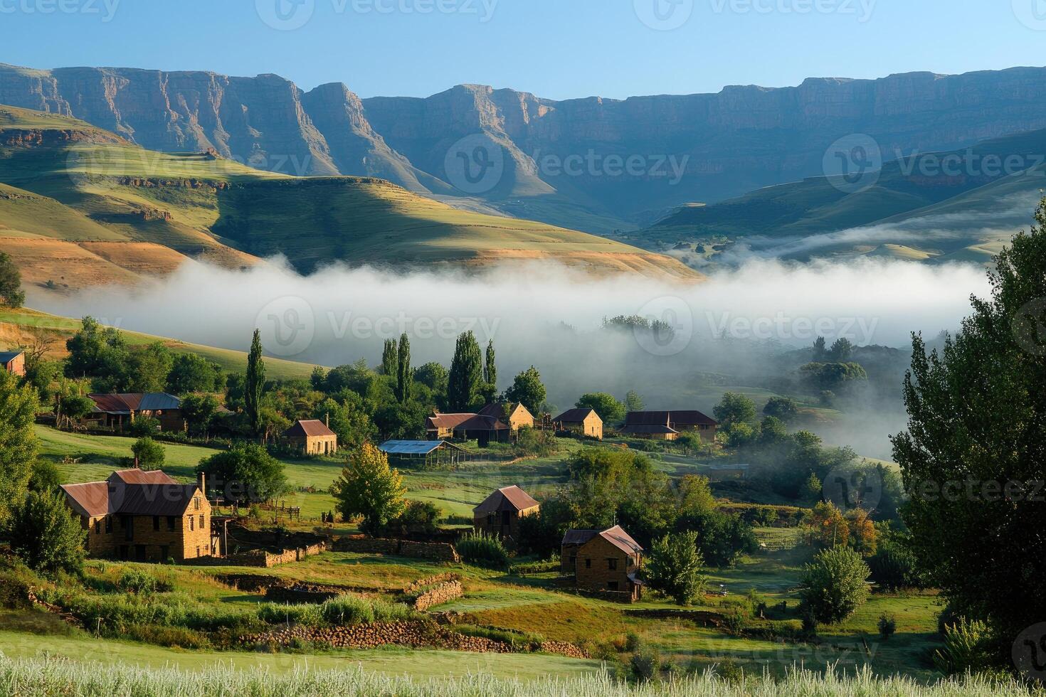 Fog rolling into a valley in the drakensberg mountains, south africa photo
