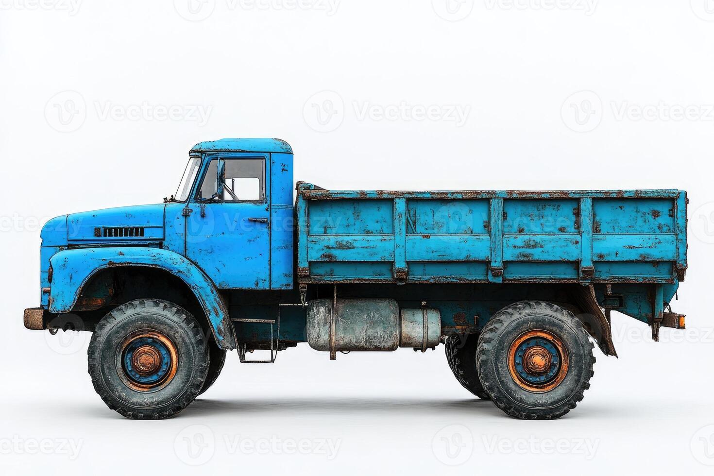 Old rusty blue tipper truck isolated on white background photo