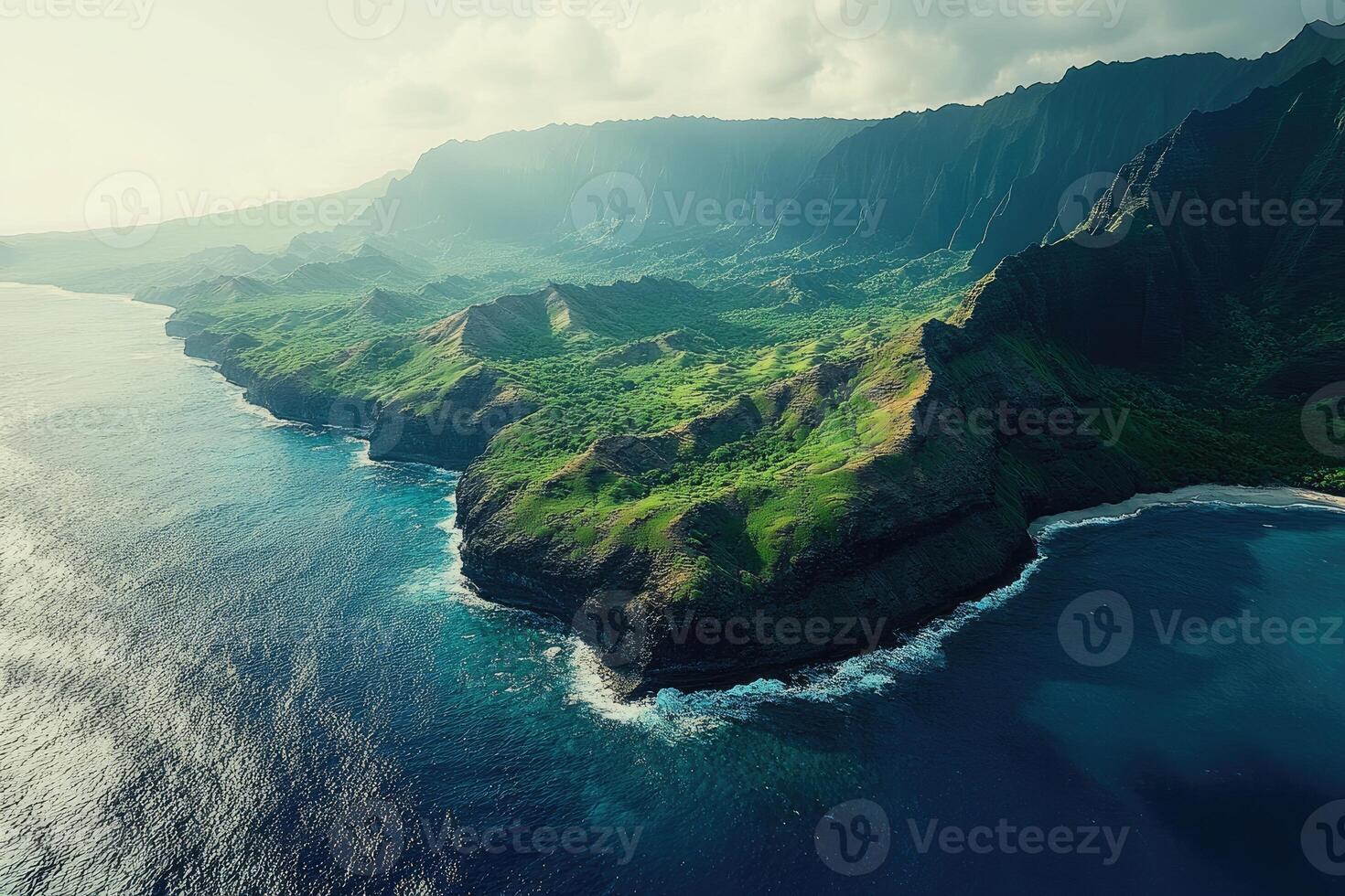Na pali coast state wilderness park kauai hawaii showing lush green cliffs meeting the pacific ocean photo