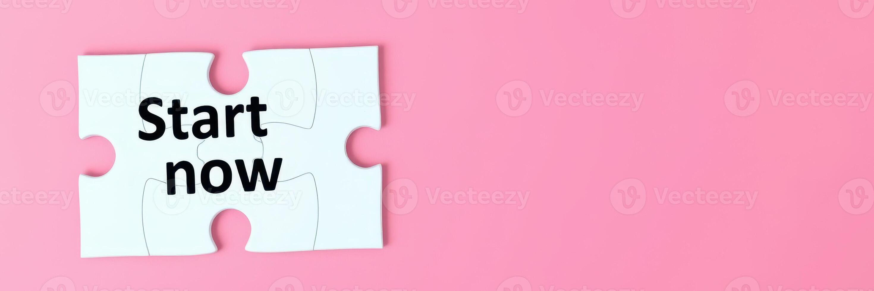 Begin your journey with a puzzle piece that says Start now on a pink background highlighting the essence of new beginnings photo