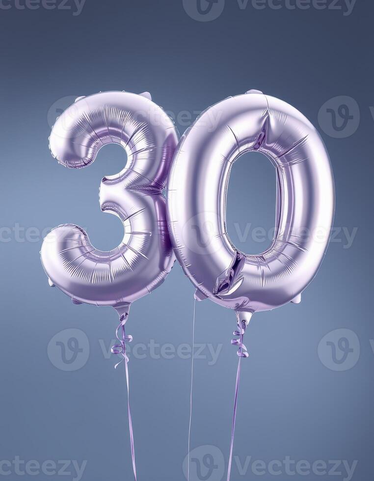 Celebrating a milestone birthday with shiny silver balloons displaying the number thirty against a blue background photo
