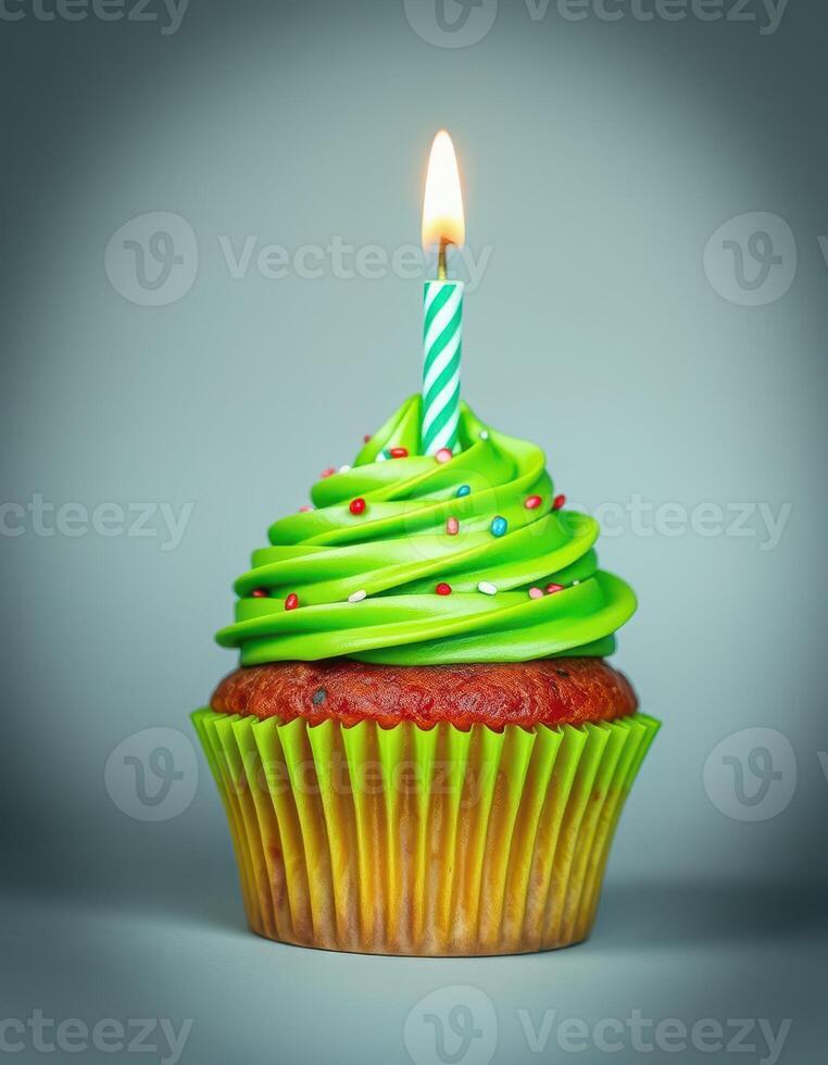 Colorful cupcake with green frosting and a lit candle for a joyful celebration moment photo