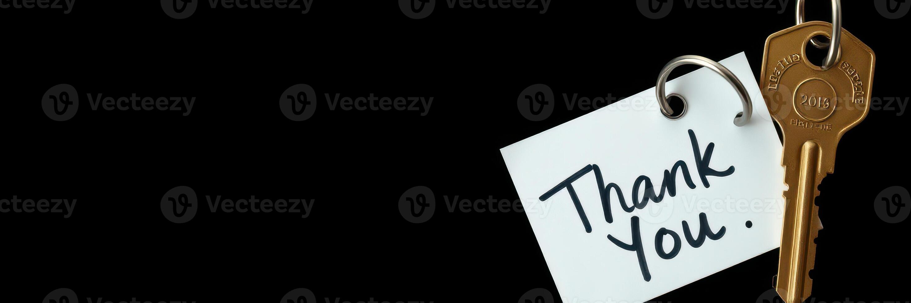 Gratitude expressed through a key tag with a handwritten thank you note on a dark background photo