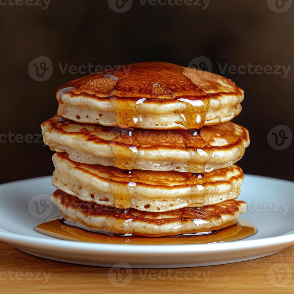 Delicious stack of pancakes drizzled with syrup photo