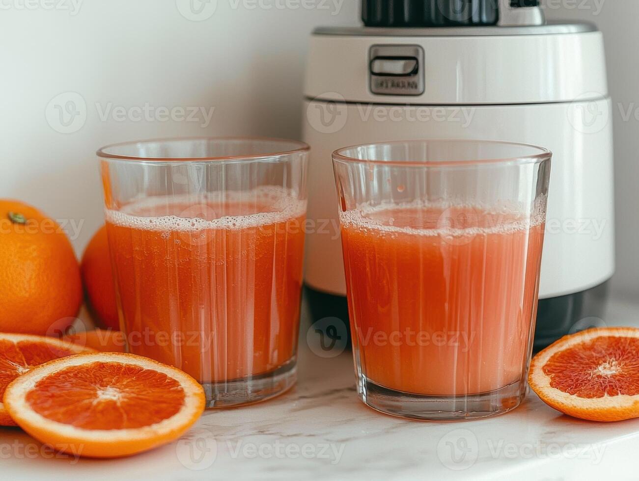 Freshly squeezed orange juice in glasses with oranges photo