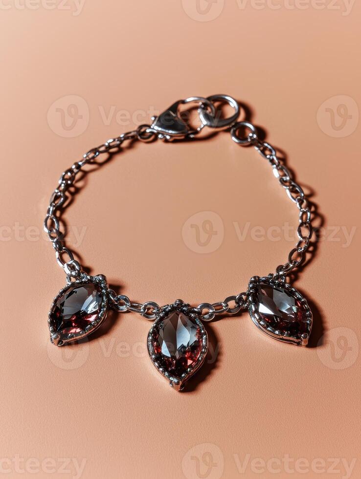 Elegant dark gemstone bracelet with silver chain and clasp photo