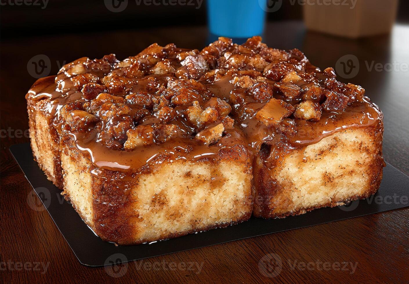 Close up of delicious caramel pecan rolls on a dark wood table photo