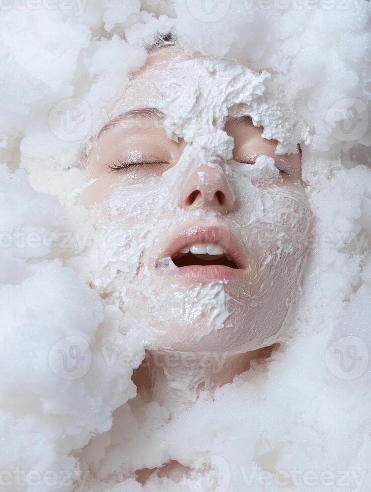 Woman with a white facial mask surrounded by fluffy white substance photo