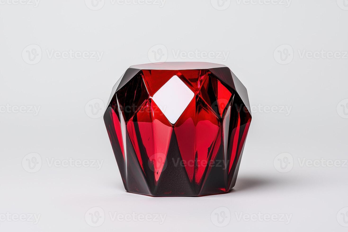 Red gemstone shaped glass table in a minimalist setting photo