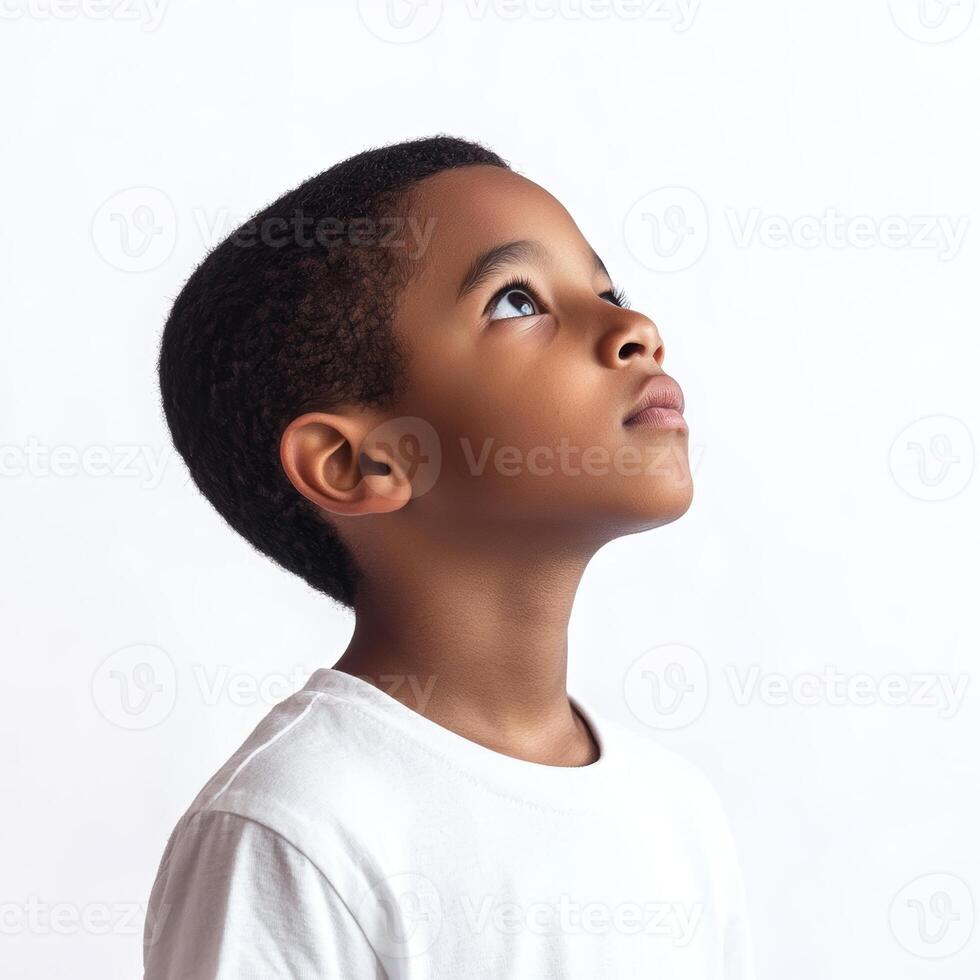 A young boy looking up at something photo