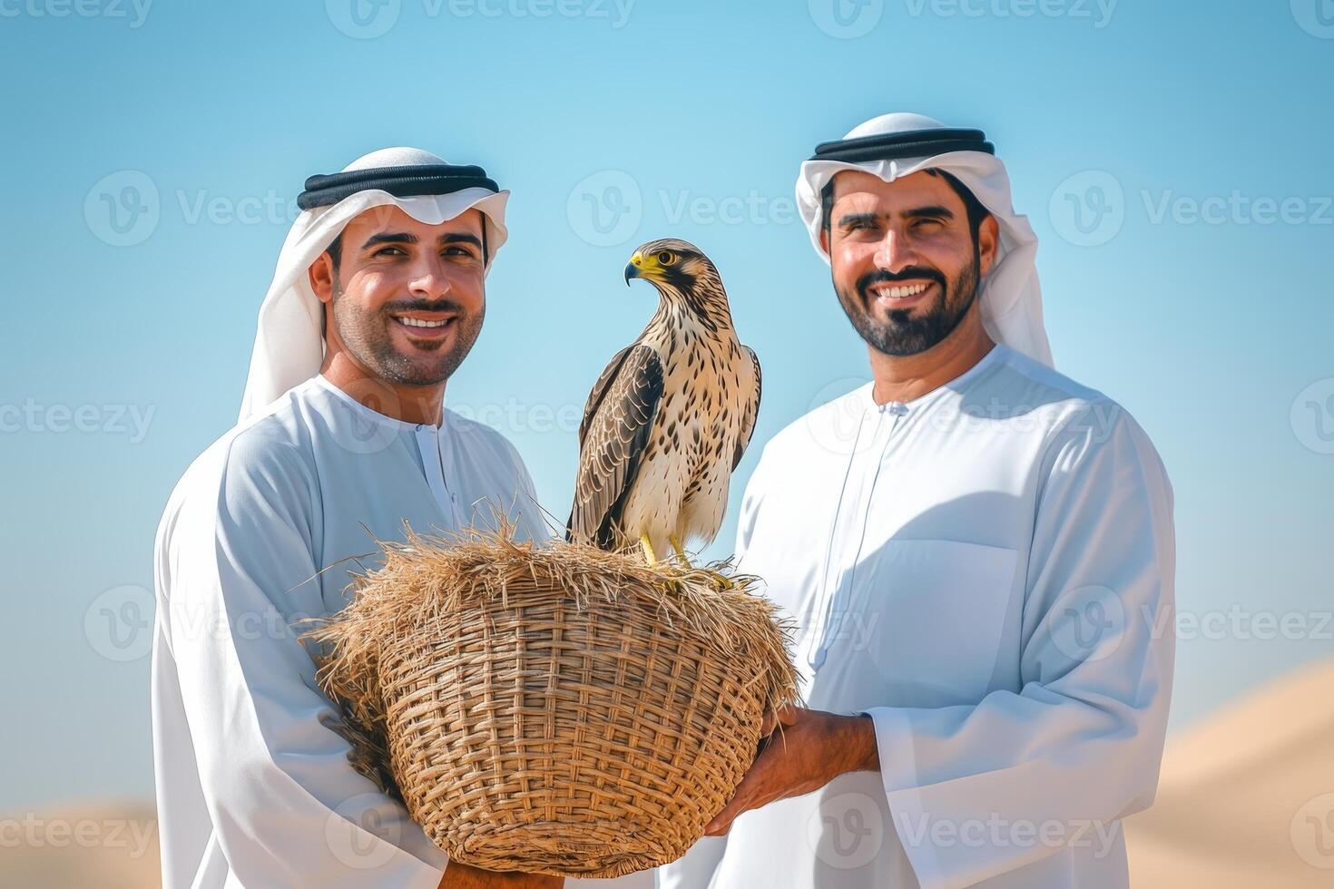 Two arabic men holding a basket with a falcon photo