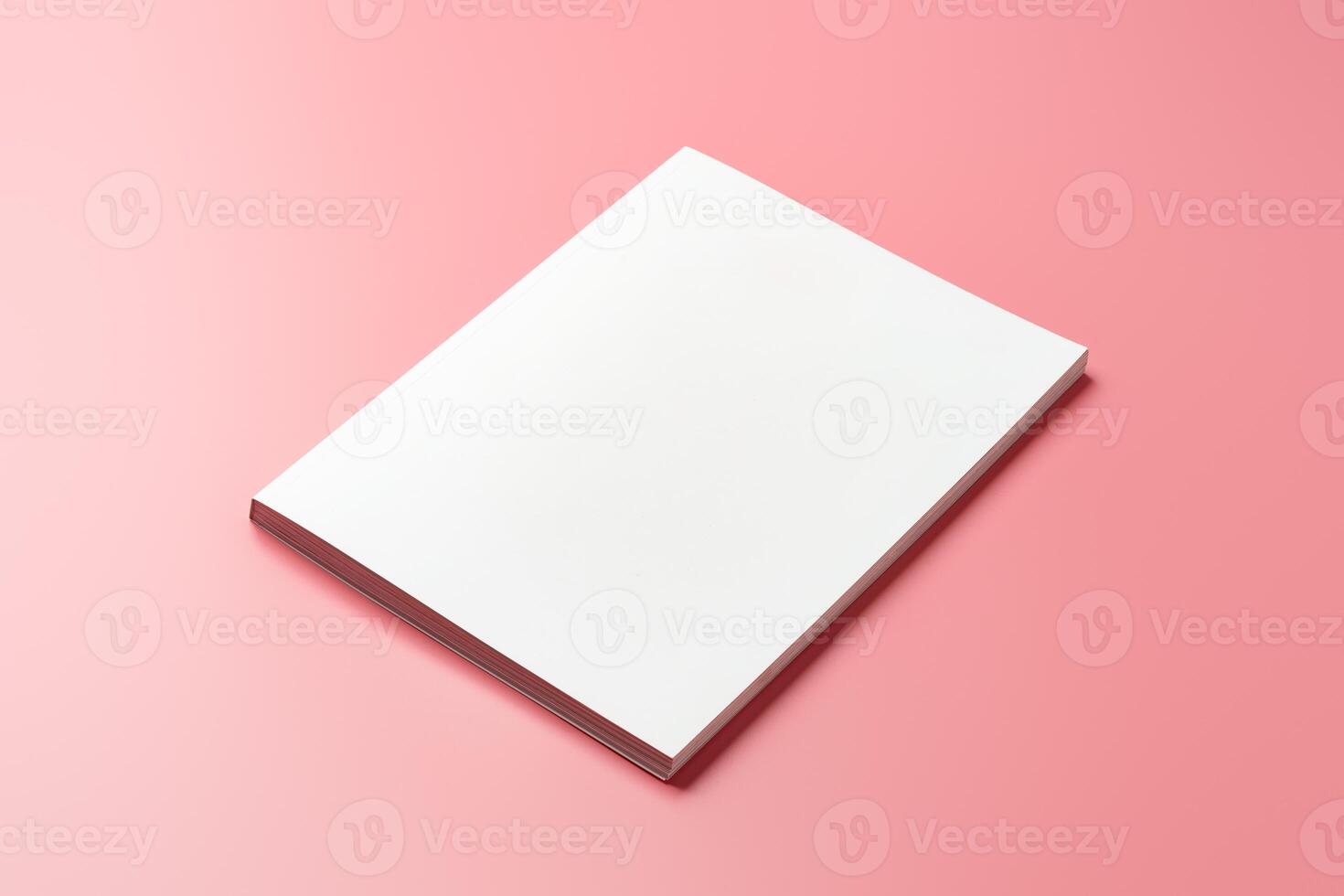 A Collection of Blank Papers Stacked on a Pink Surface for Creative Projects photo