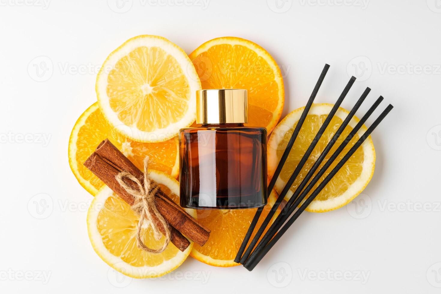 Aromatic display of essential oils with citrus fruit and chopsticks on a minimalist background photo