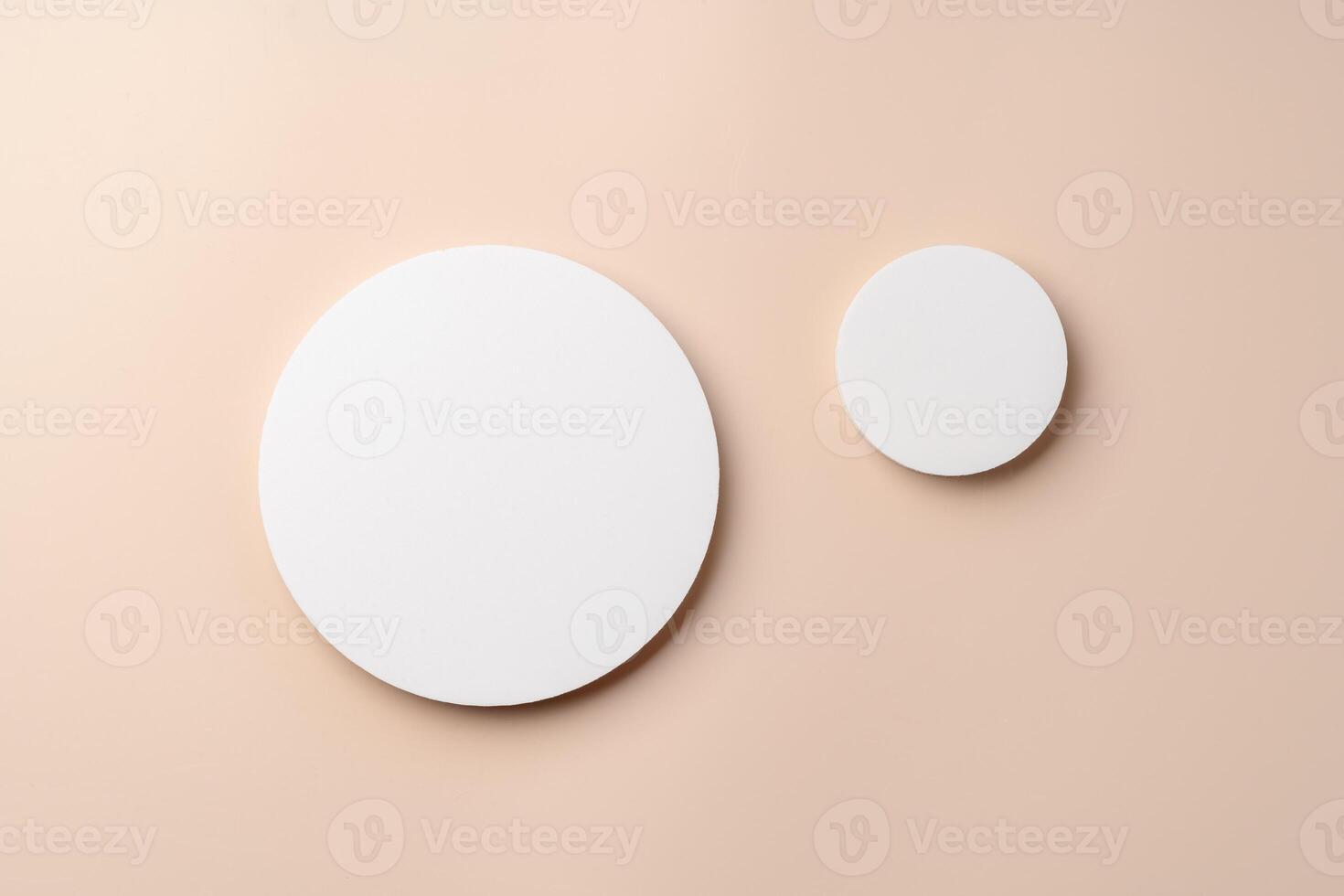 Simple Design With Two White Circular Shapes Against a Soft Beige Background in Modern Interior Space photo