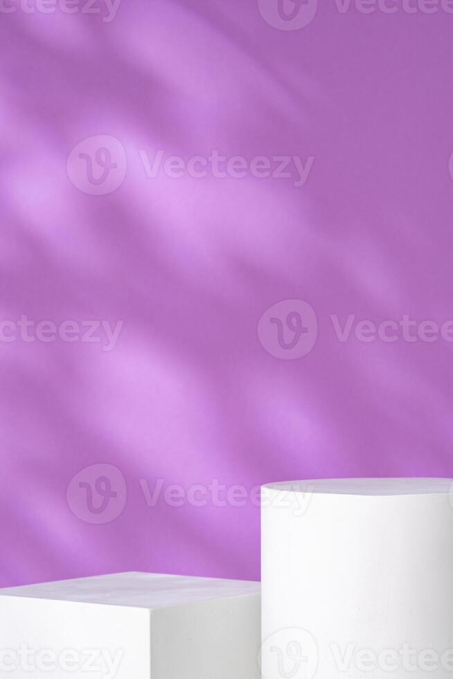 White geometric shapes against a soft purple background with gentle shadows photo