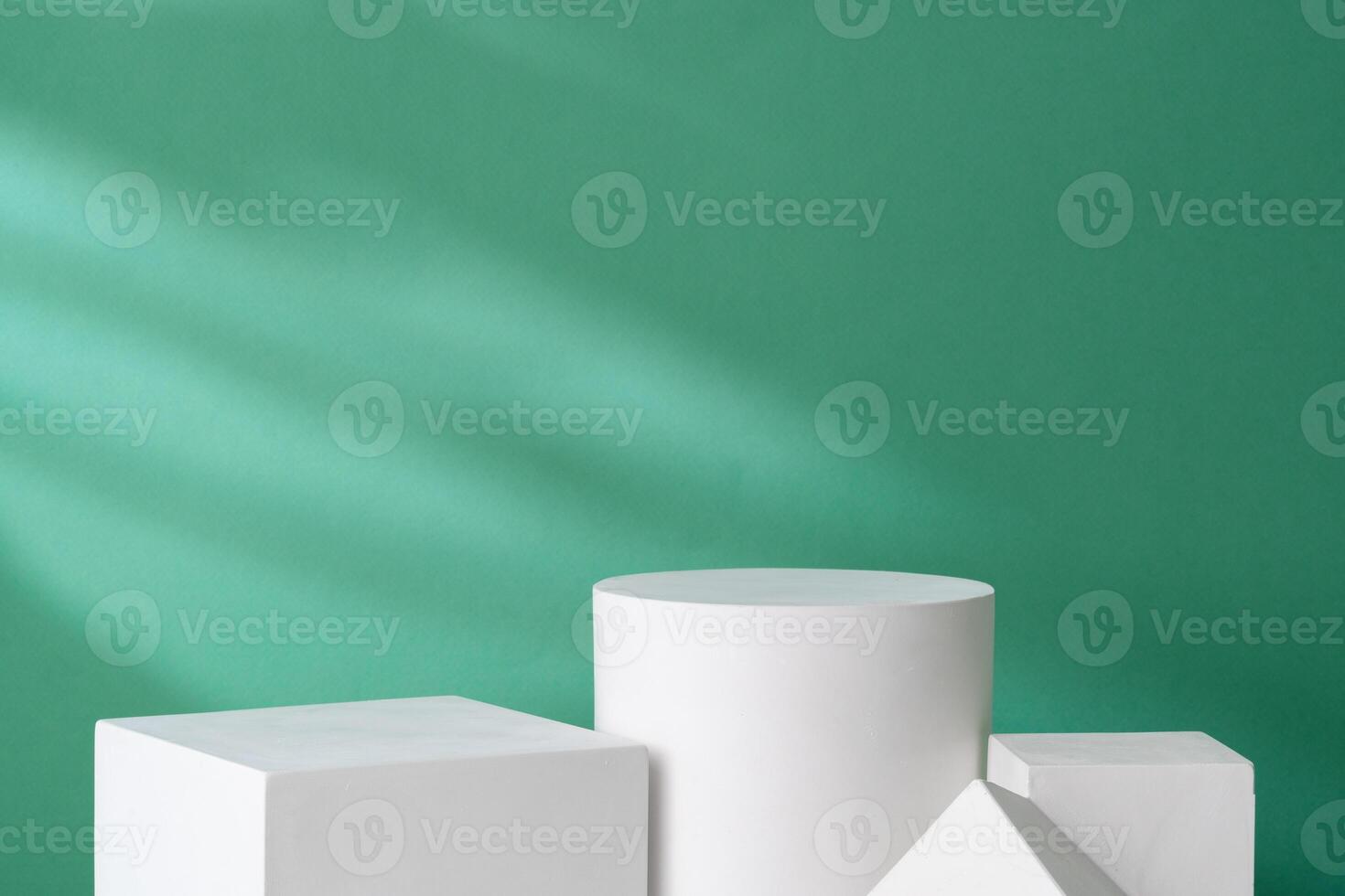 Simple geometric shapes on a green background with soft lighting photo