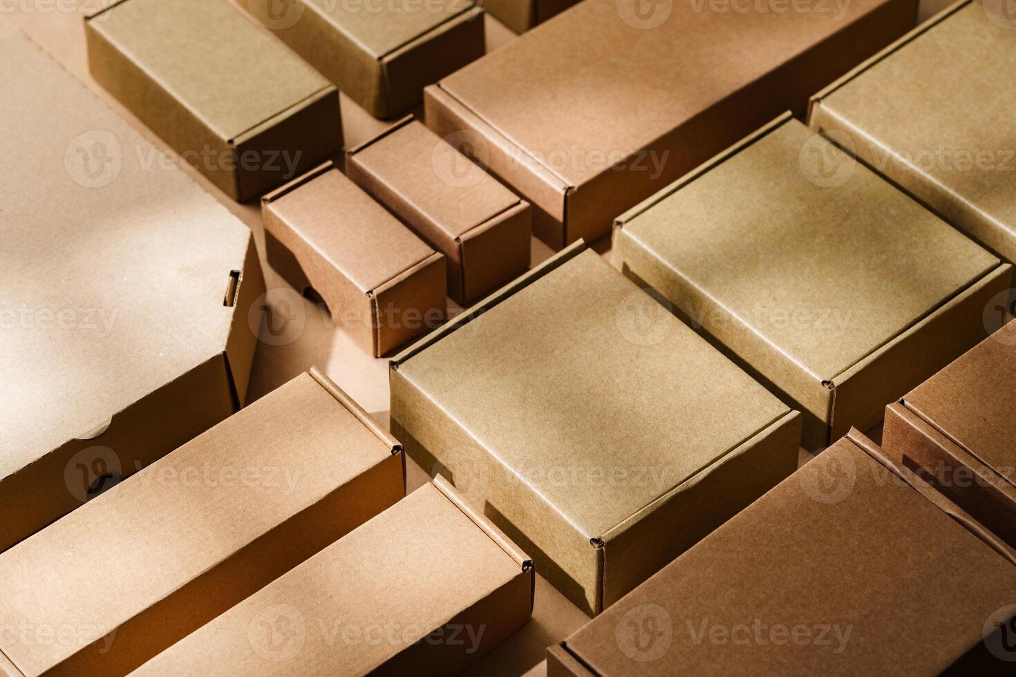 Multiple cardboard boxes arranged on a surface for packaging and shipping in a warehouse setting photo