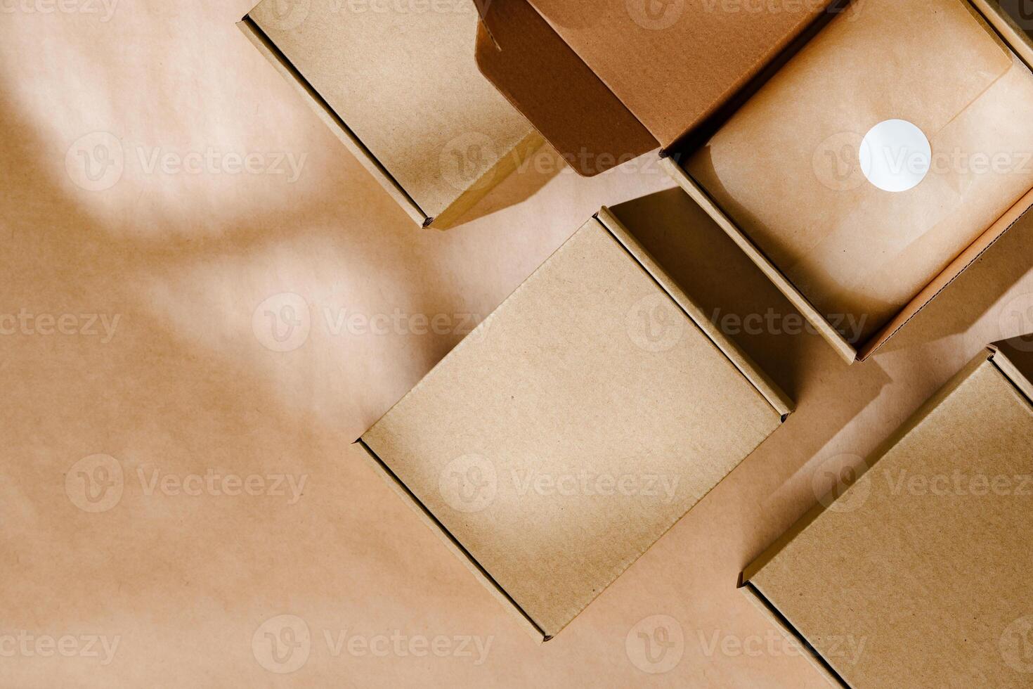 Brown cardboard boxes arranged neatly on a workspace, showcasing packaging materials for shipping and storage activities photo