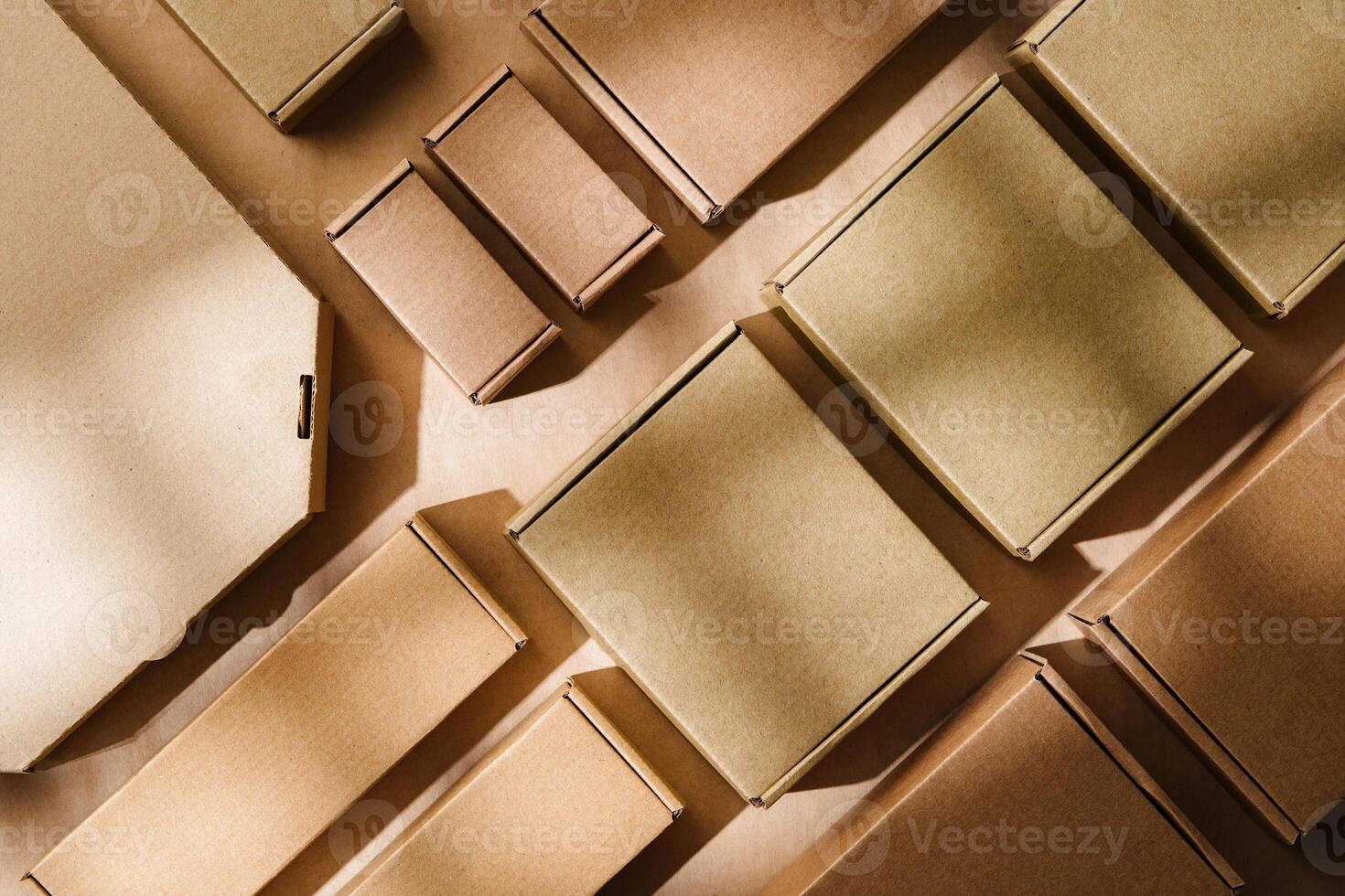 Multiple cardboard boxes arranged on a surface for packaging and shipping in a warehouse setting photo
