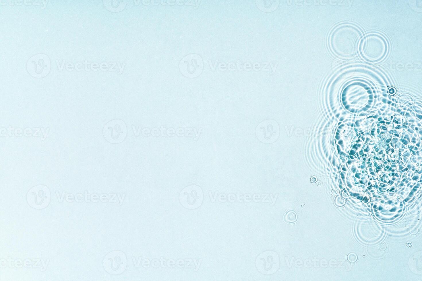 Gentle ripples form on a serene blue surface photo