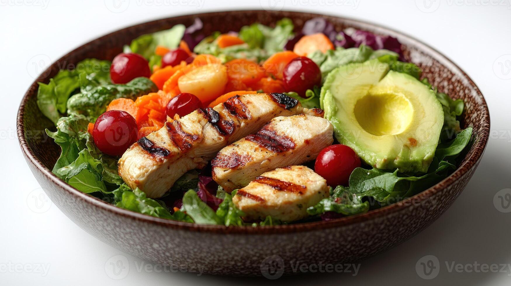 A vibrant mix of greens, grilled chicken, and fresh vegetables offers a delicious meal photo