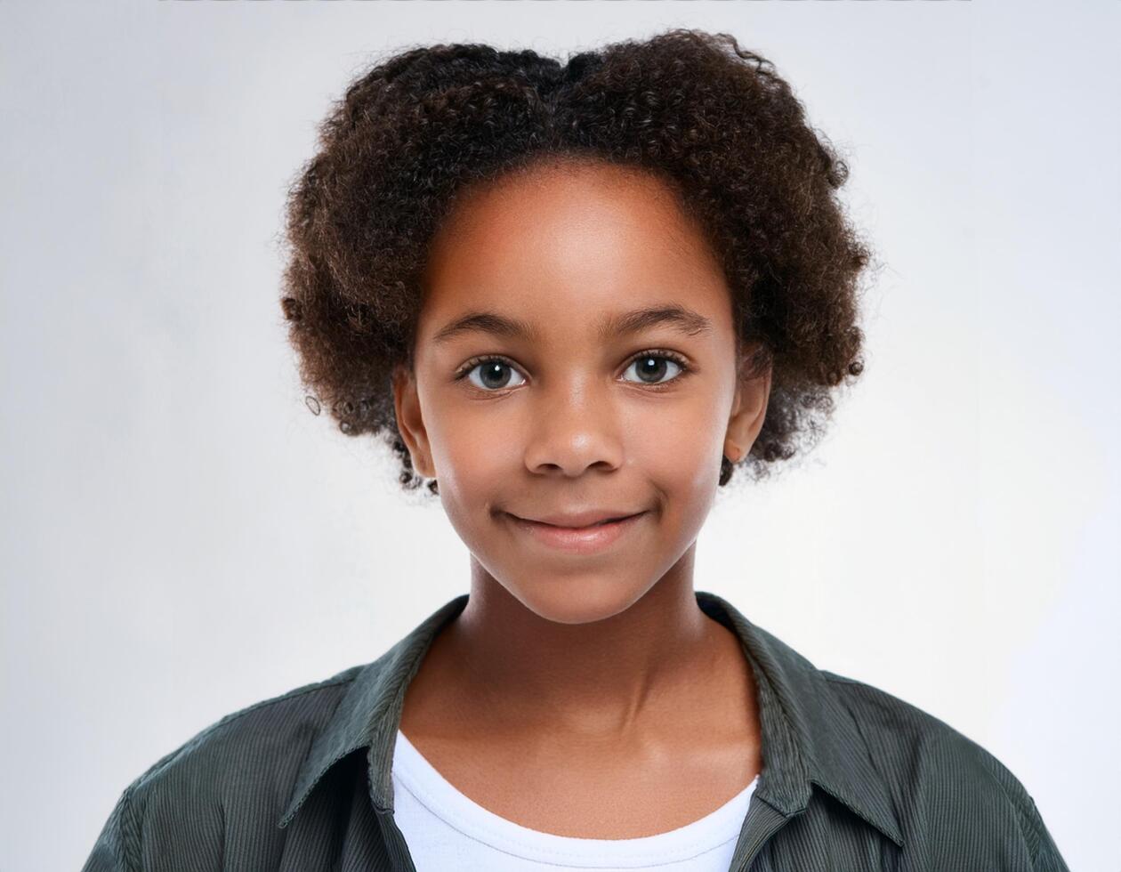 Studio Portrait of African Teenager with Short and Defined Curls on White Background photo
