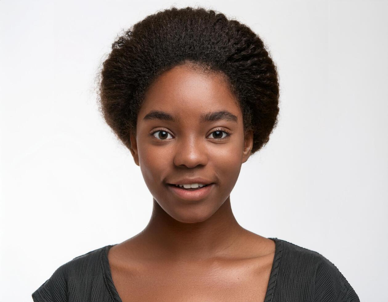 Portrait of African Teenager with High Fade Hairstyle and Expression on White Background photo