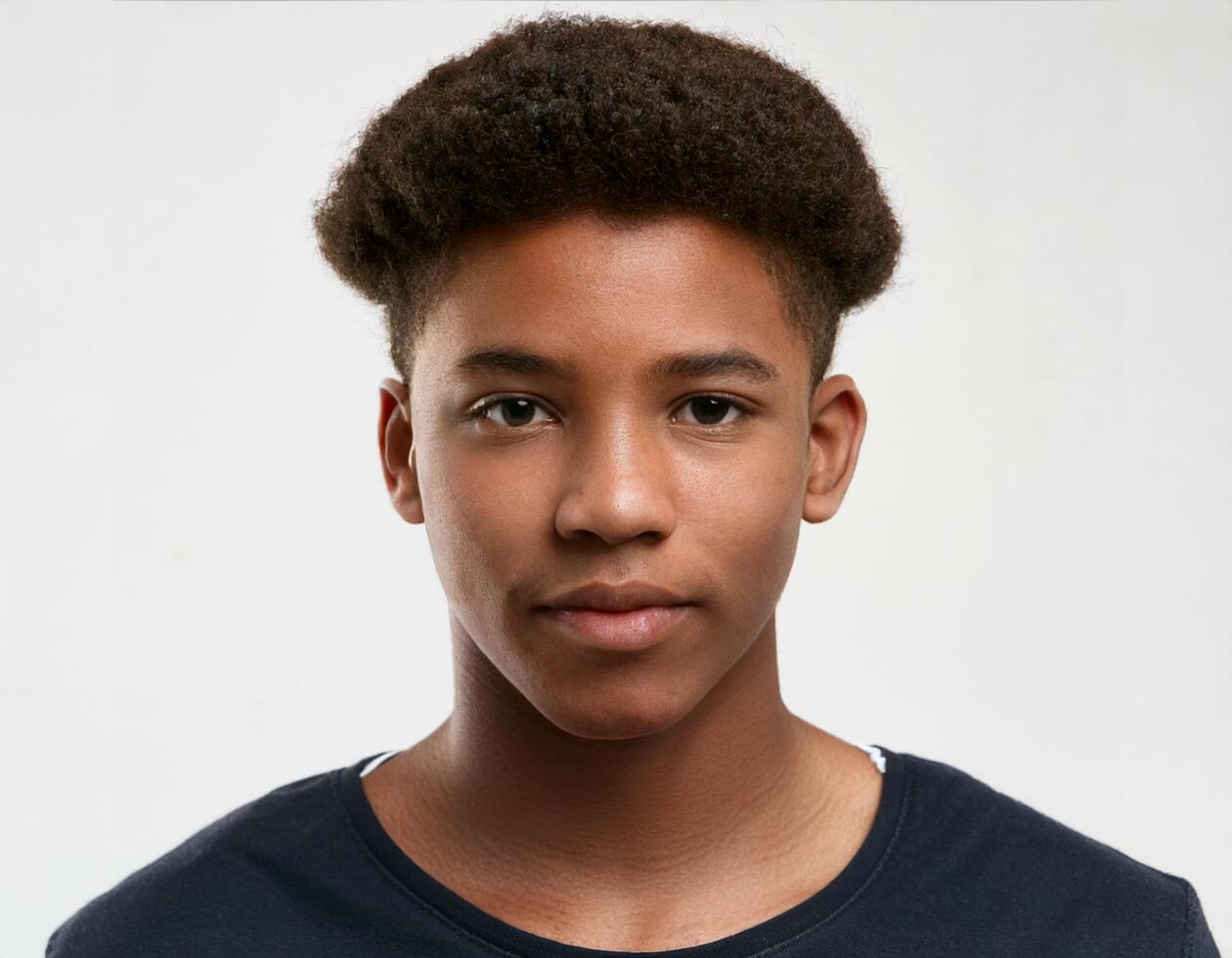 Portrait of African Teenager with Smooth Textured Curls and Expression on White Background photo