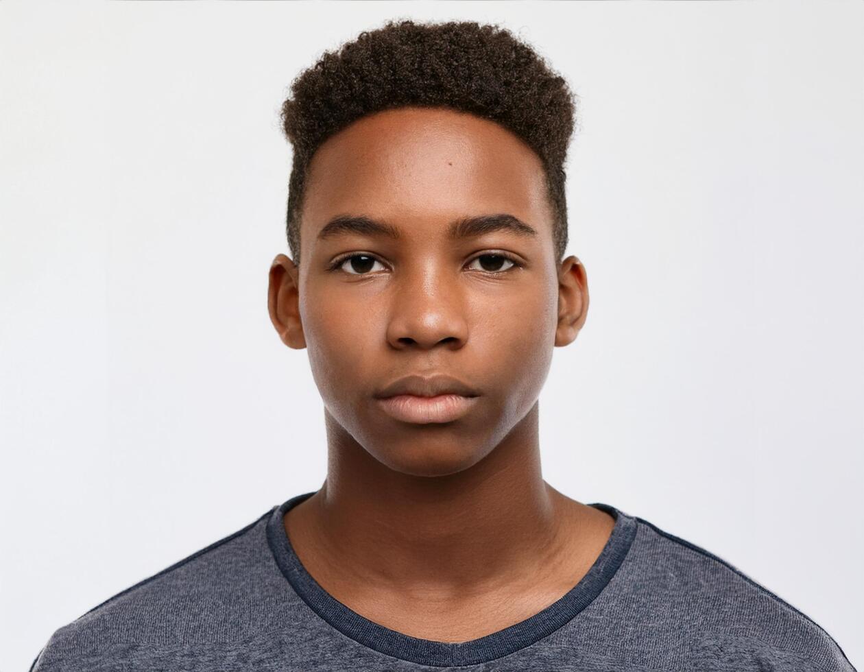Portrait of African Teenager with Defined Natural Waves and Soft Expression on White Background photo