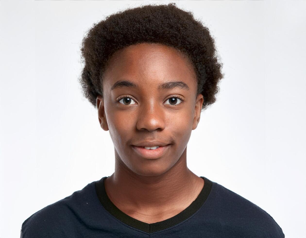 Close Up Portrait of African Teenager with Defined Loose Ringlets on White Background photo