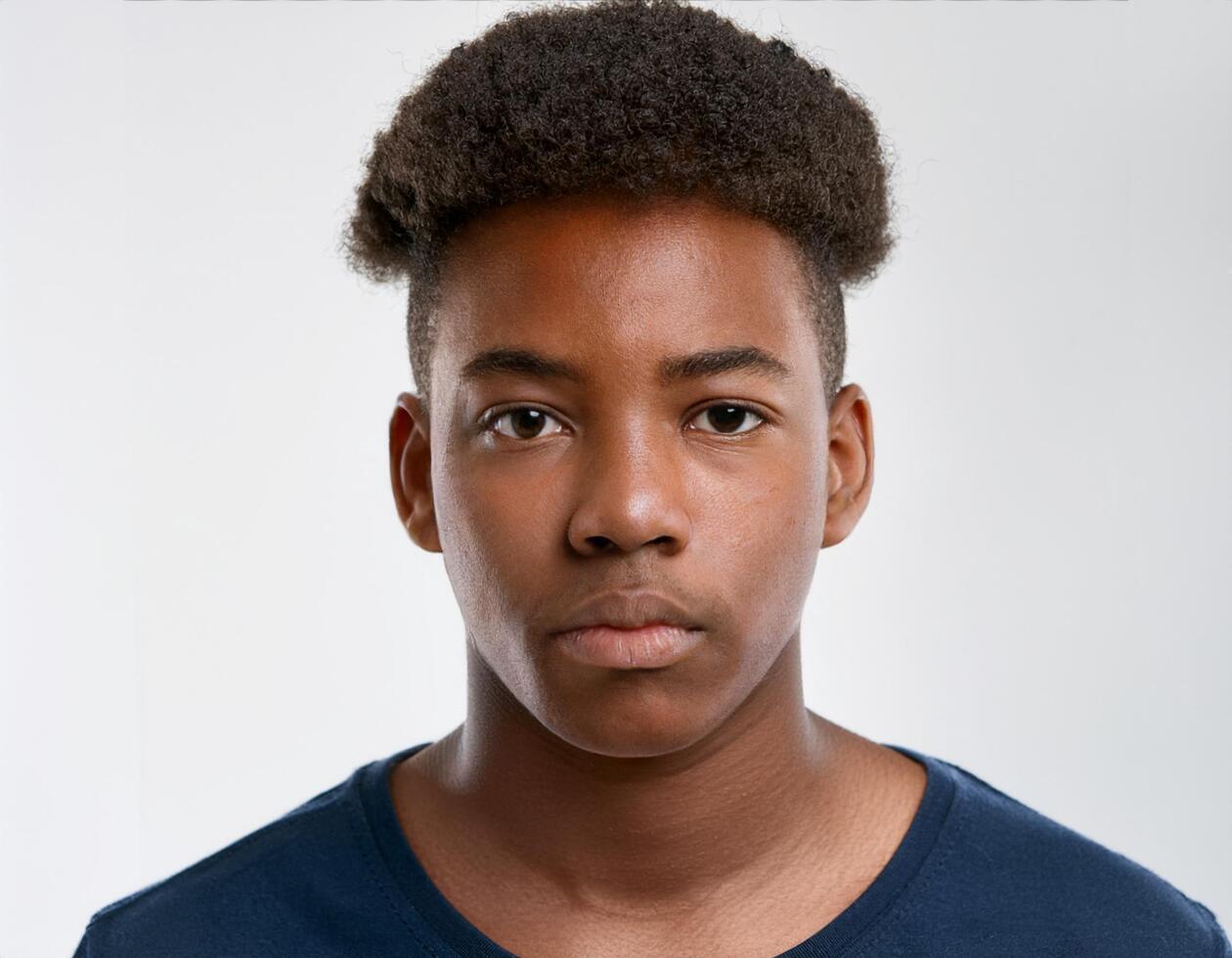 Portrait of African Teenager with Defined Short Curly Bob on White Background photo