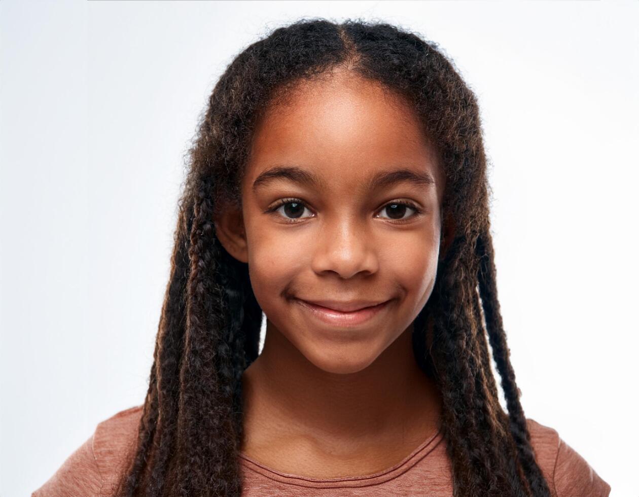 Studio Portrait of African Teenager with Defined Medium Braided Curls on White Background photo