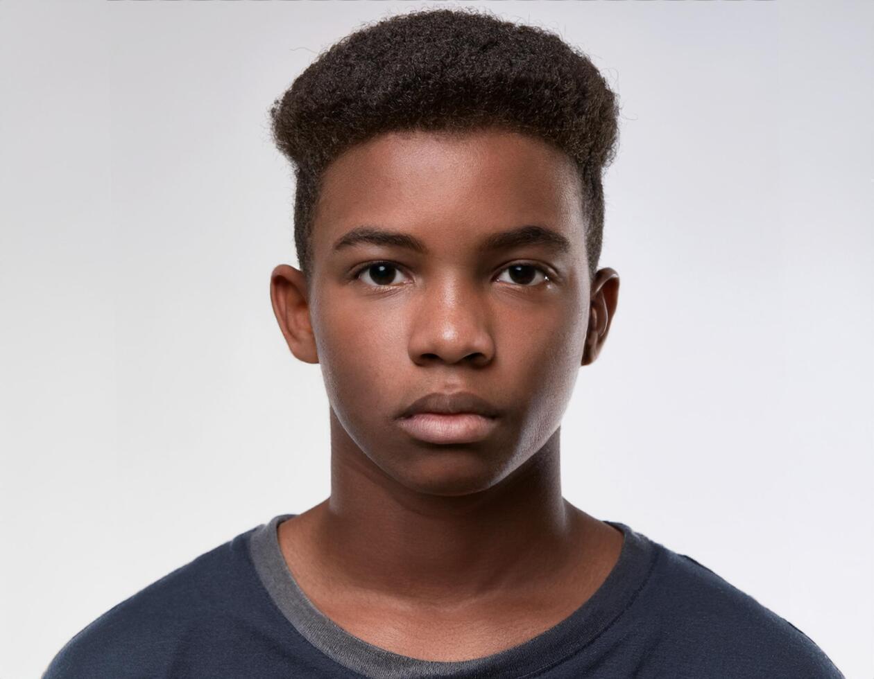 Portrait of African Teenager with Defined Side Swept Textured Curls on White Background photo