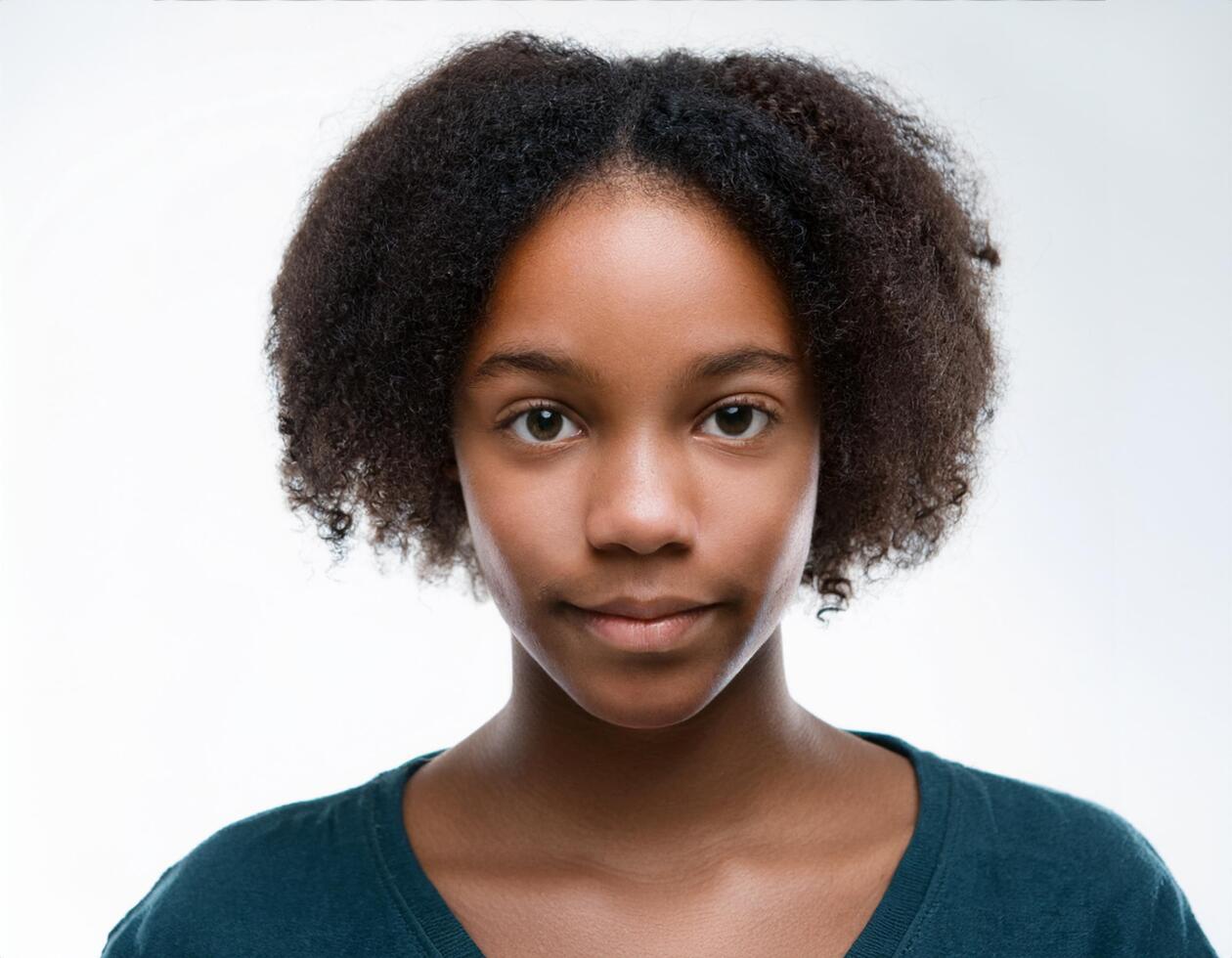 Studio Portrait of African Teenager with Defined Defined Medium Length Curly Hairstyle on White Background photo