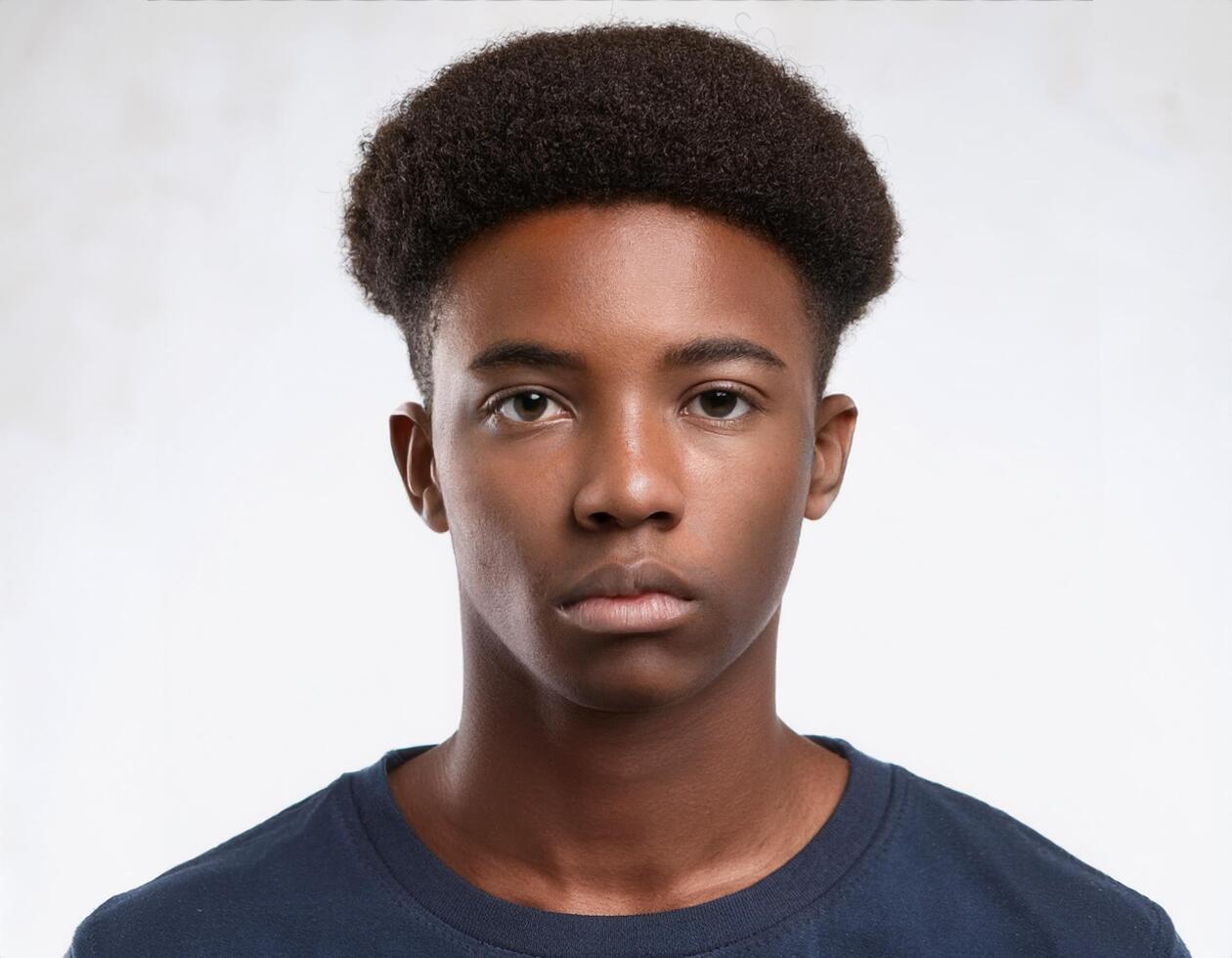 Portrait of African Teenager with Defined Defined High Curly Dreads on White Background photo